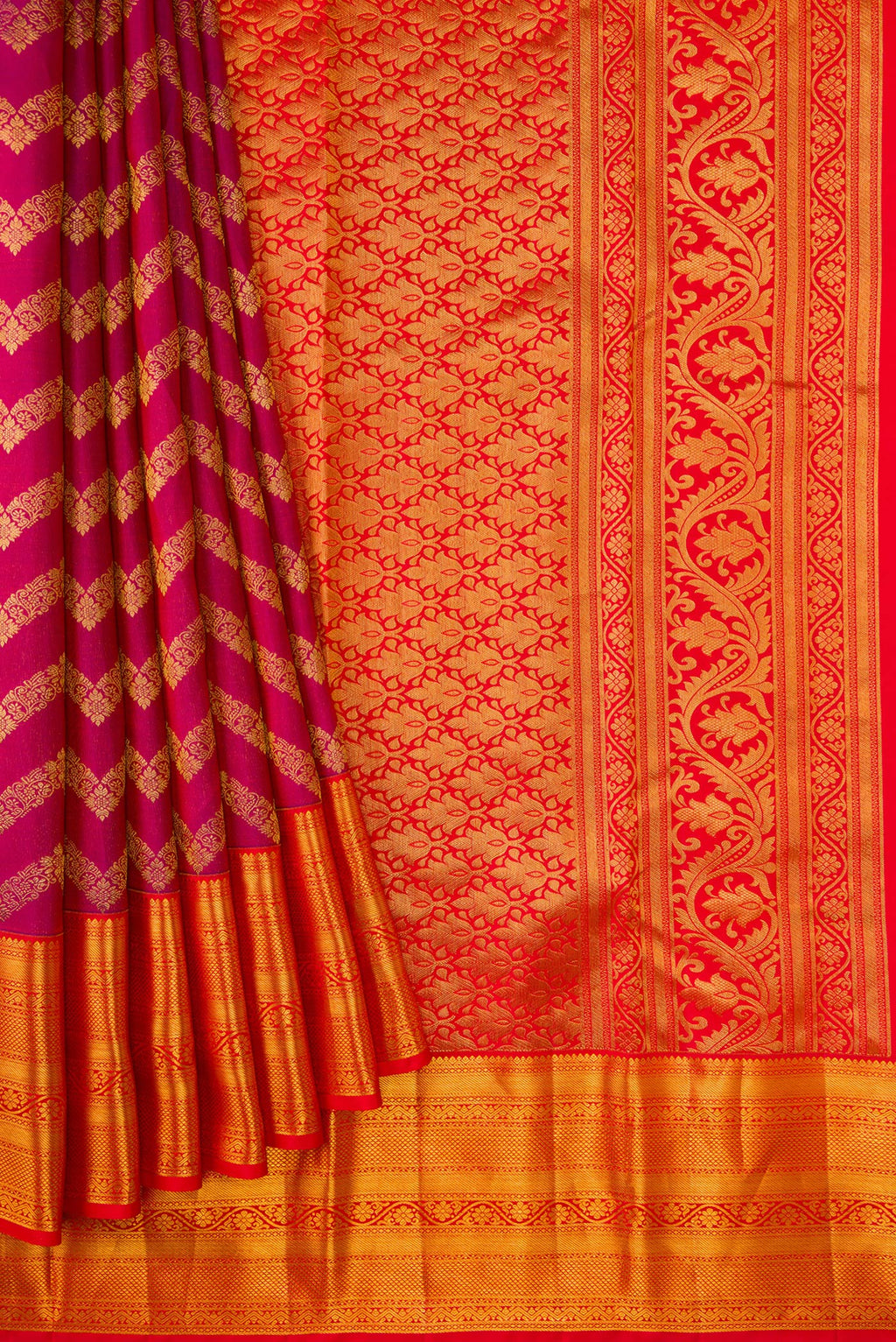 Pleats and pallu of Magenta Kanchipuram Silk Saree with Zari Brocade on the body and Zari Border. 