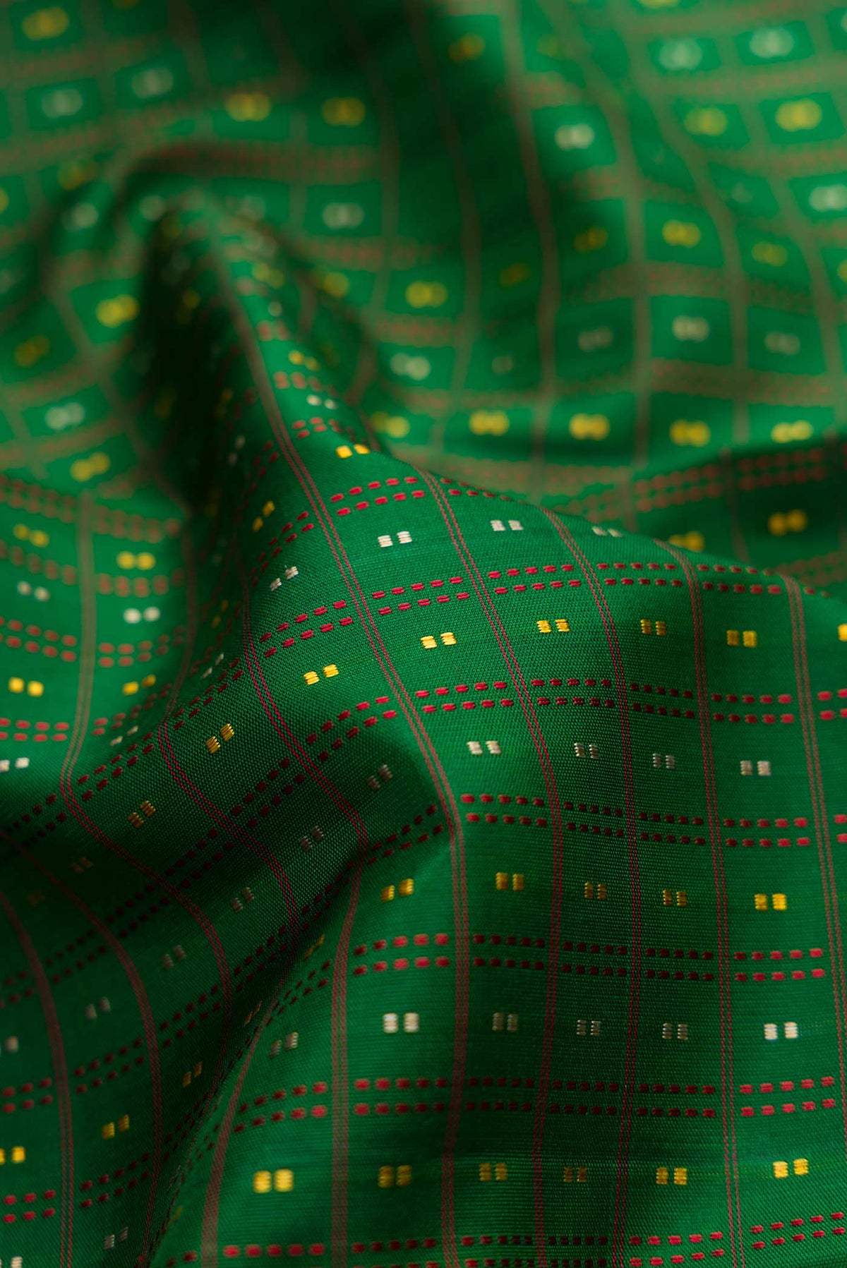 Close up of Bottle Green Dual Tone Kanchipuram Silk Saree with Stripes on the body and Zari Border displaying folds