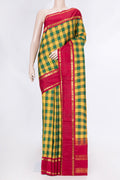 Yellow and Green Color Kanchipuram Saree with Checked design on the body and Zari Border displayed on a mannequin
