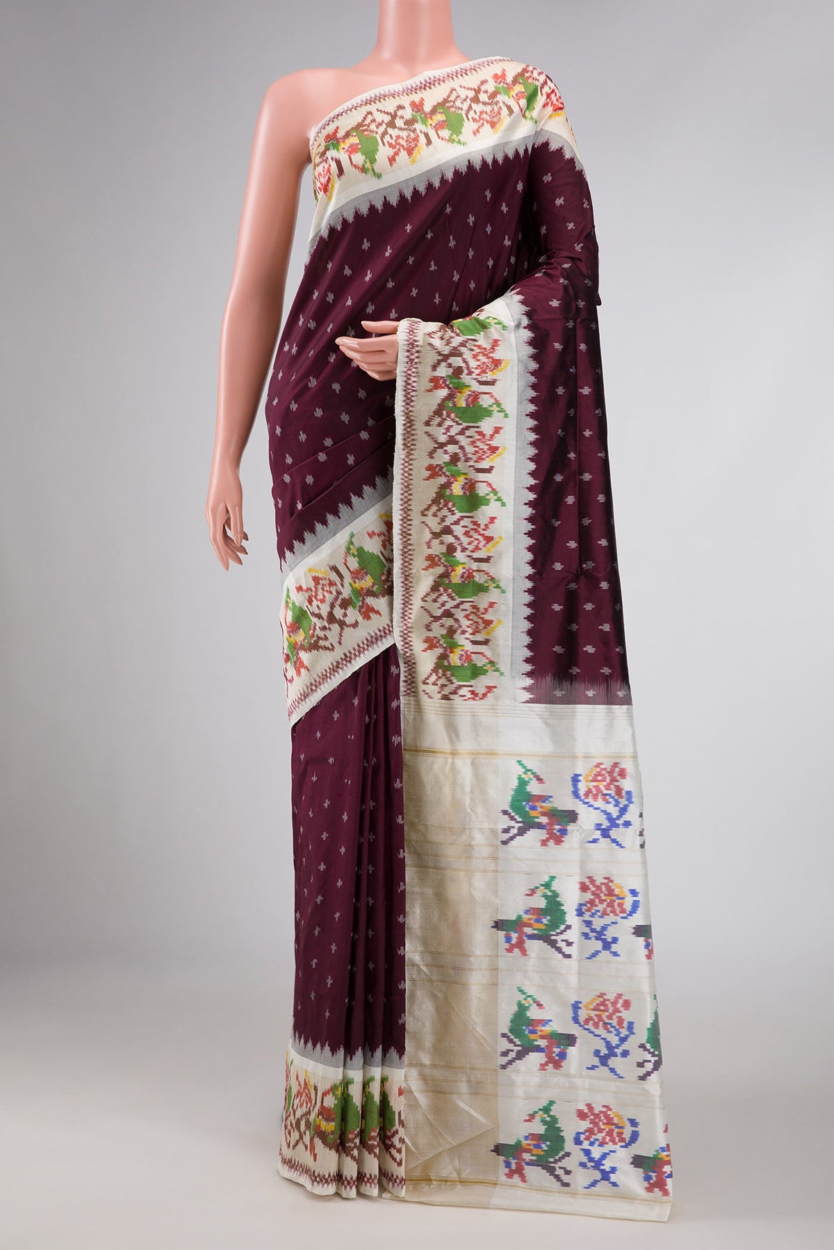 Burgundy Dual Tone Double Ikat Saree with Ikat Print on the body and Ikat Border displayed on a mannequin