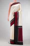 Sandal Dual Tone Double Ikat Saree with Plain Body and Ikat Border.  displayed on a mannequin