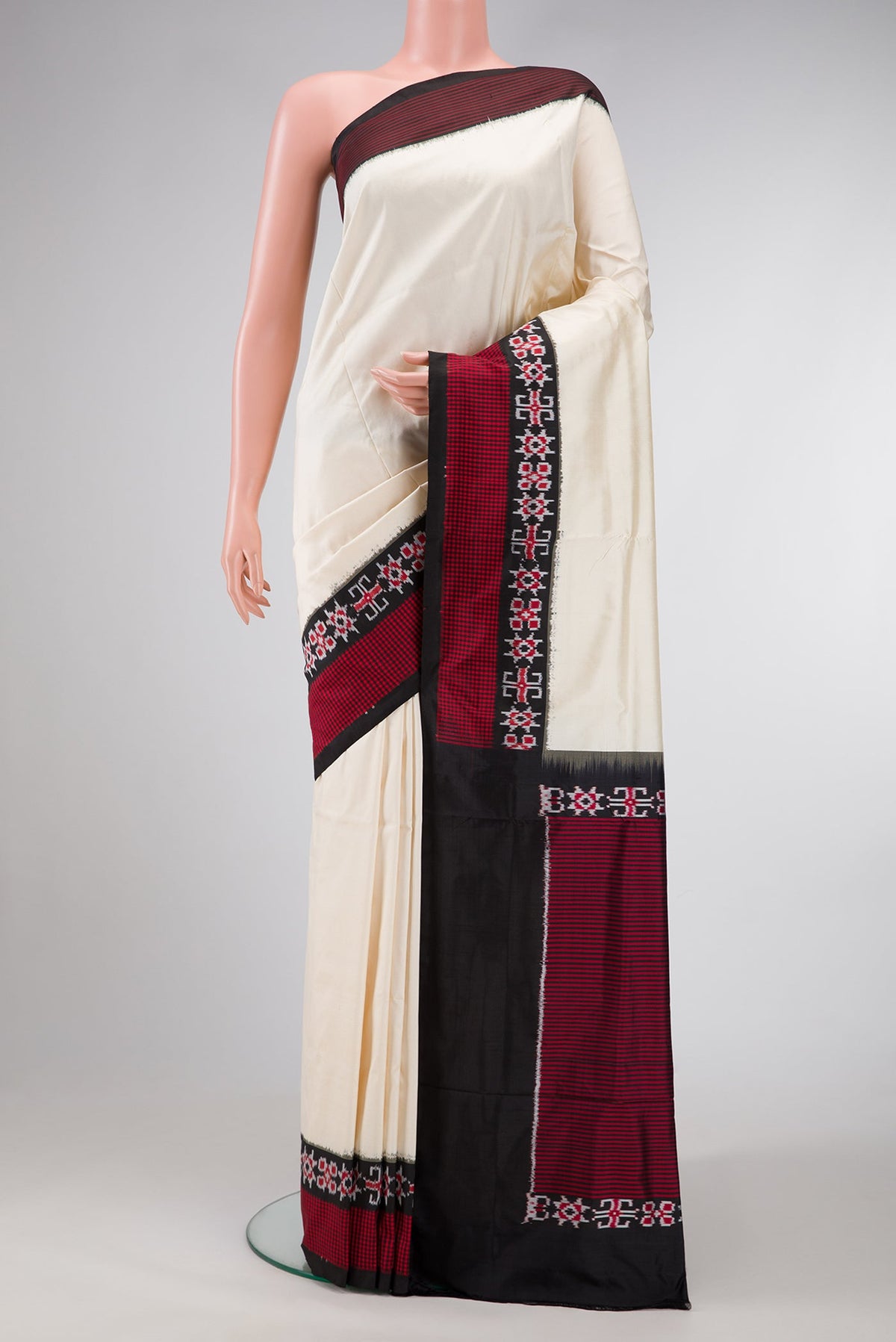 Sandal Dual Tone Double Ikat Saree with Plain Body and Ikat Border.  displayed on a mannequin