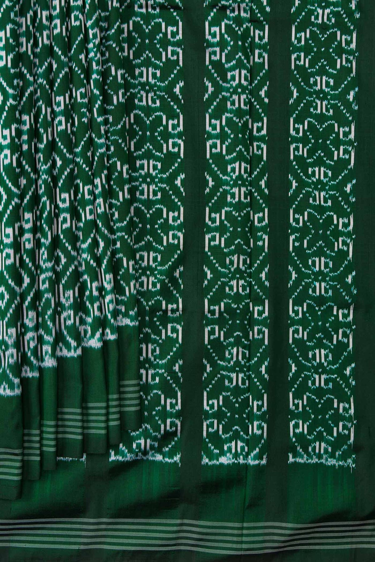 Pleats and pallu of Green Dual Tone Double Ikat Saree with Ikat Print on the body and Zari Border. 