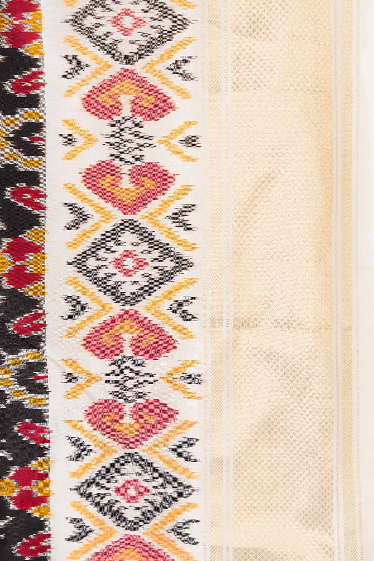 Border image of Black Dual Tone Double Ikat Saree with Ikat Print on the body and Ikat Border