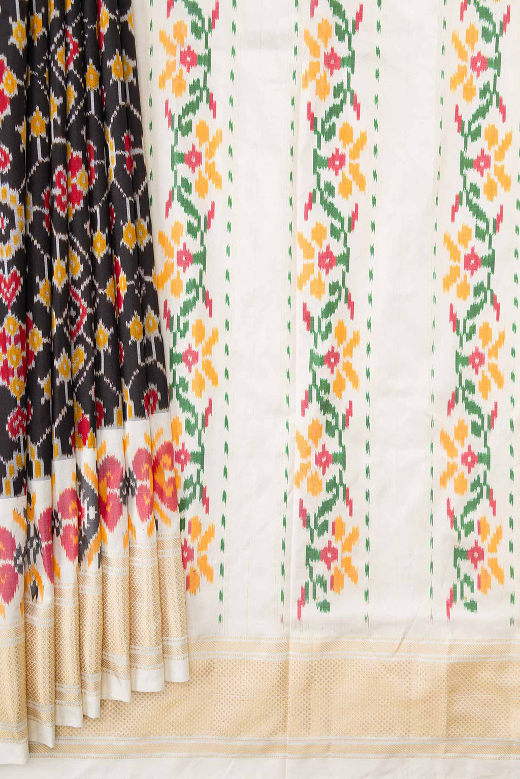 Pleats and pallu of Black Dual Tone Double Ikat Saree with Ikat Print on the body and Ikat Border