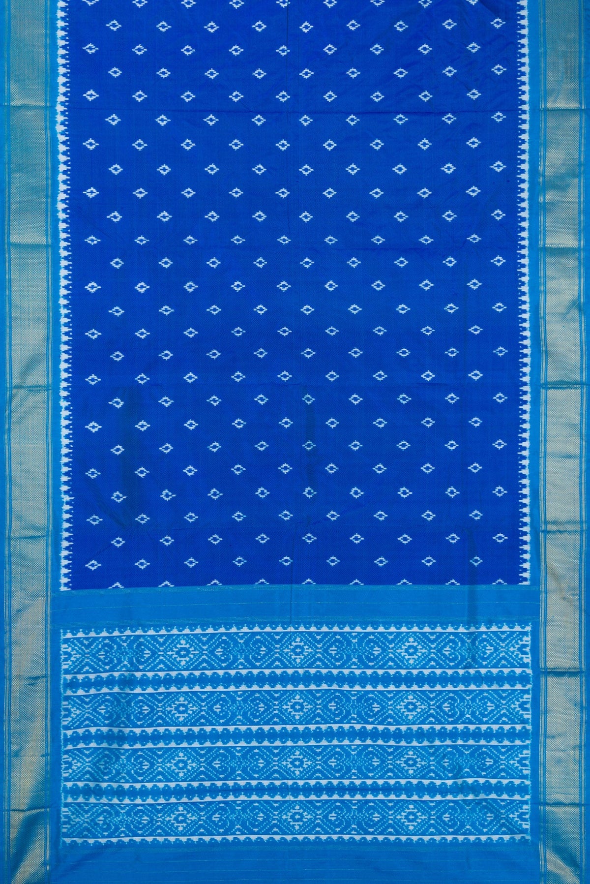 Flat view of Peacock Blue Dual Tone Double Ikat Nine Yards Saree with Ikat Print on the body and Zari Border. 