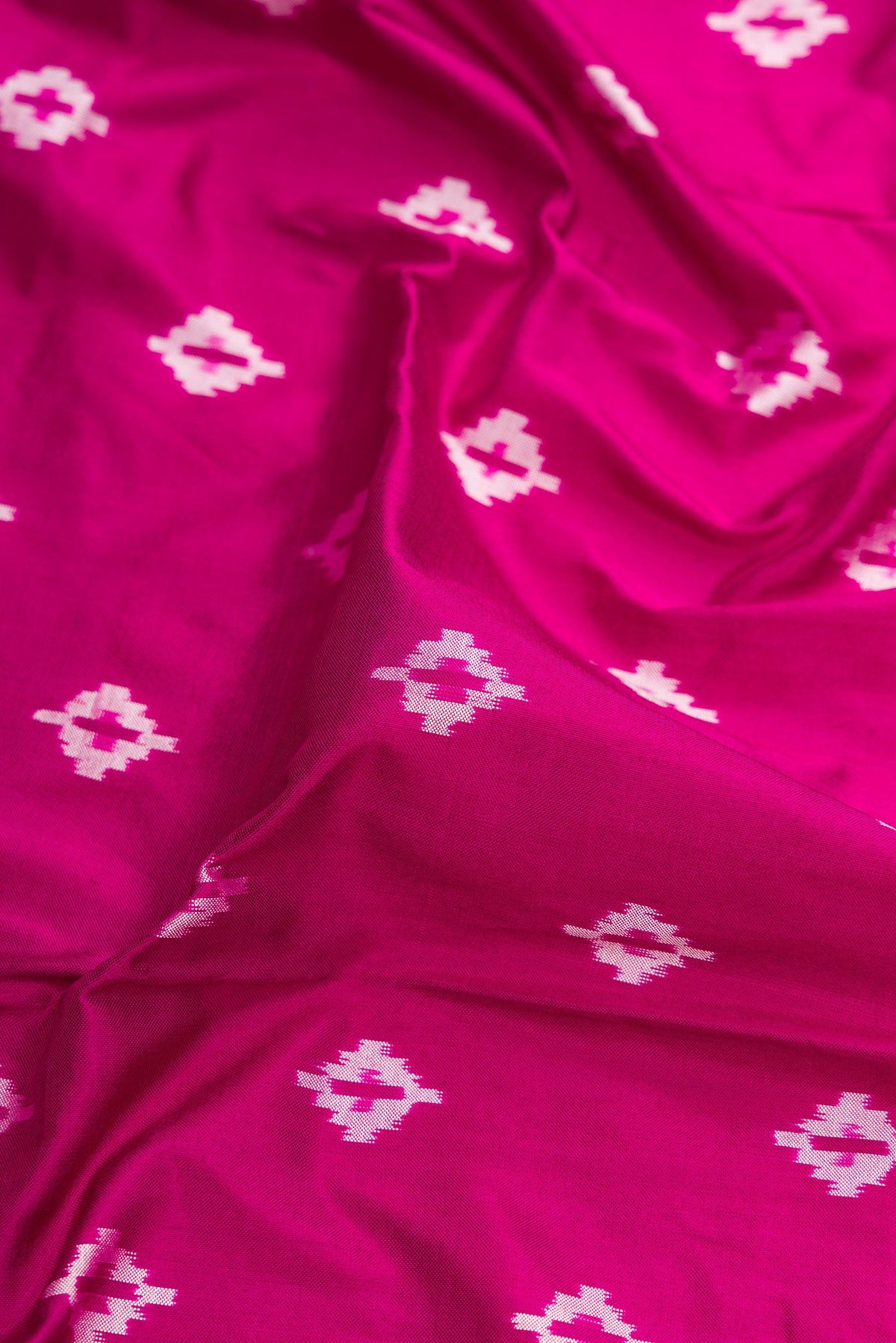 Close up of Purple Dual Tone Double Ikat Nine Yards Saree with Ikat Print on the body and Zari Border.  displaying folds