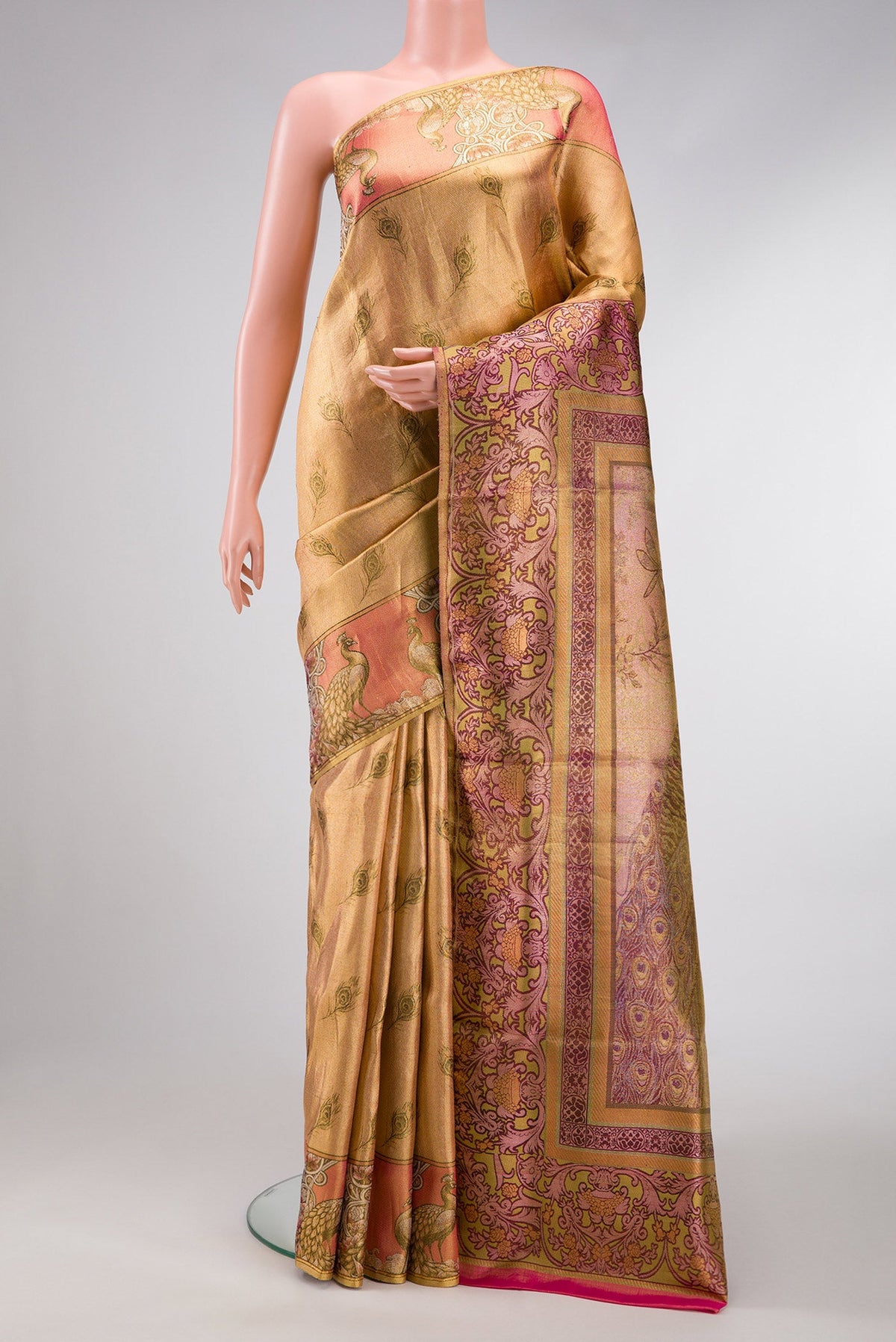 Gold Dual Tone Kanjivaram Tissue Silk Saree with Zari Brocade on the body and Fancy Border.  displayed on a mannequin