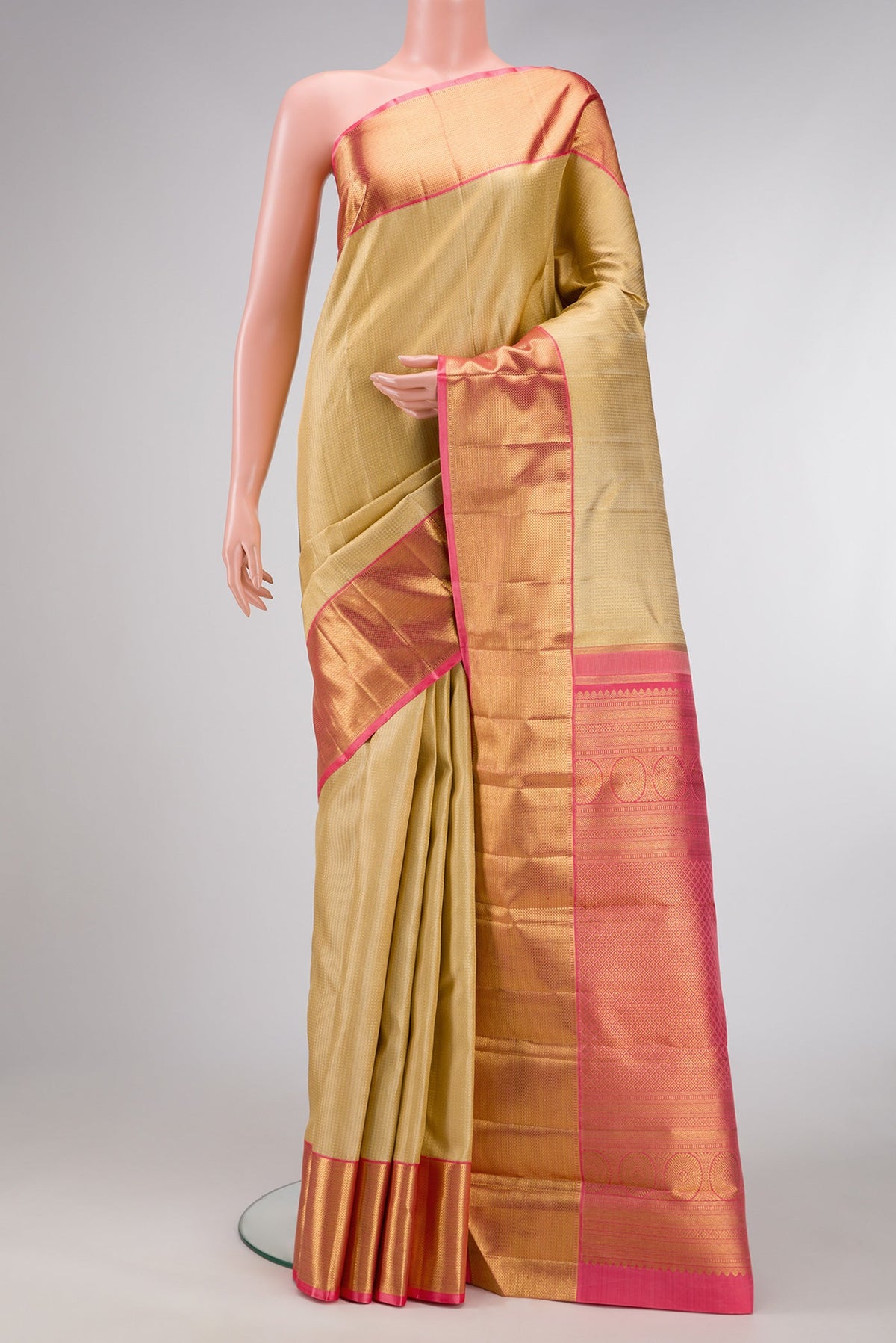 Pure Silk Pure Zari Gold Dual Tone Kanjivaram Saree with Zari Brocade on the body and Zari Border.  displayed on a mannequin