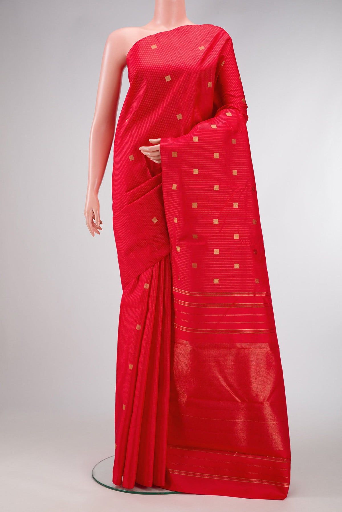 Pure Silk Pure Zari Red Dual Tone Kanchipuram Saree with Zari Butta on the body and Without Border.  displayed on a mannequin