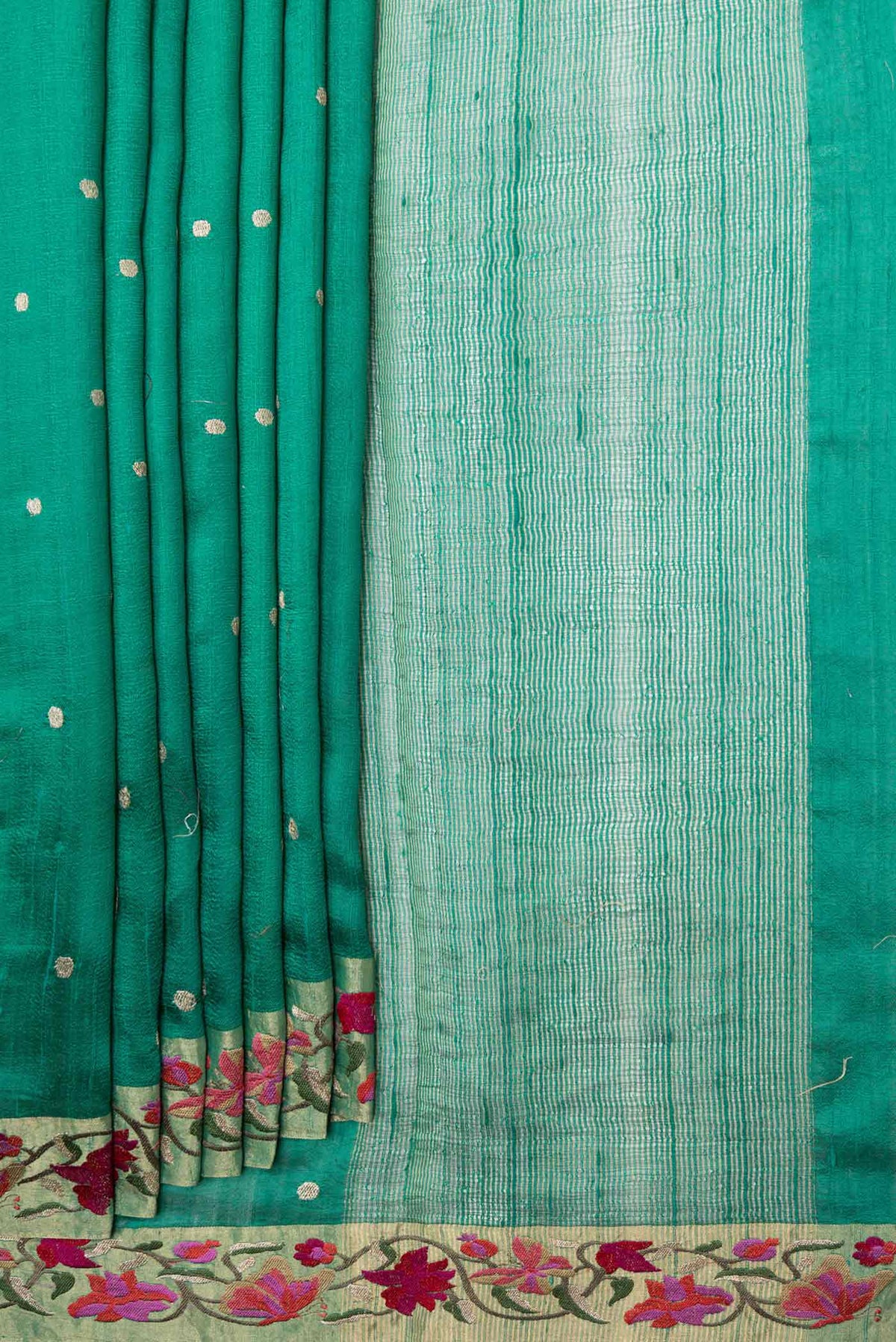 Pleats and pallu of Green Tussar Silk Saree with Embroidery on the body and Embroidery Border