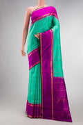 Pure Silk Pure Zari Sea Green Dual Tone Kanjivaram Saree with Checked design on the body and Zari And Thread Border.  displayed on a mannequin
