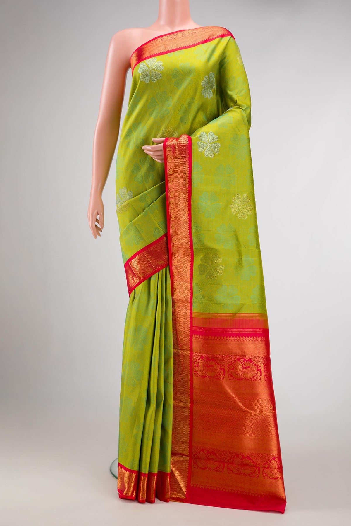 Pure Silk Pure Zari Parrot Green Dual Tone Kanchipuram Saree with Jacquard With Zari Butta on the body and Zari Border.  displayed on a mannequin