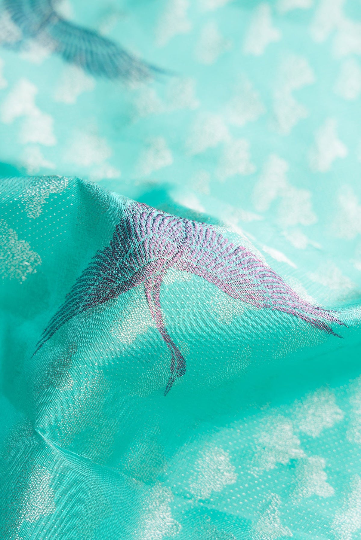 Close up of Sky Blue Dual Tone Kanchipuram Silk Saree with Zari Brocade on the body and Without Border.  displaying folds