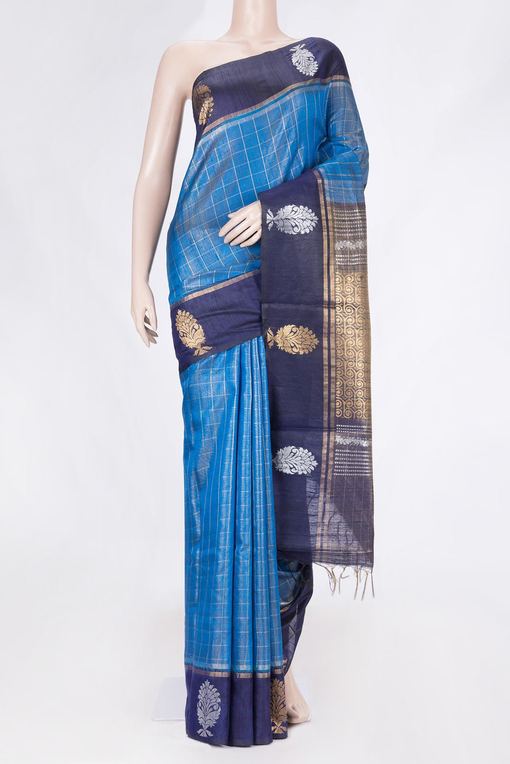 Sky Blue Dual Tone Tussar Saree with Checked design on the body and Fancy Border displayed on a mannequin