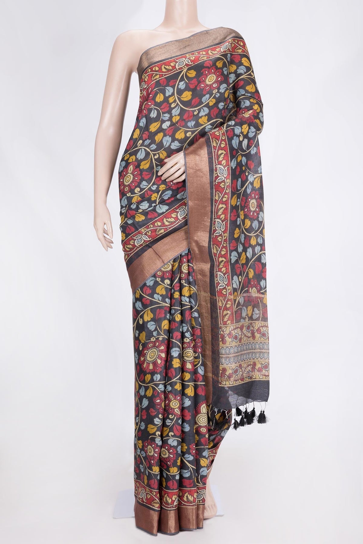 Black Dual Tone Tussar Saree with kalamkari Print on the body and Zari Border.  displayed on a mannequin
