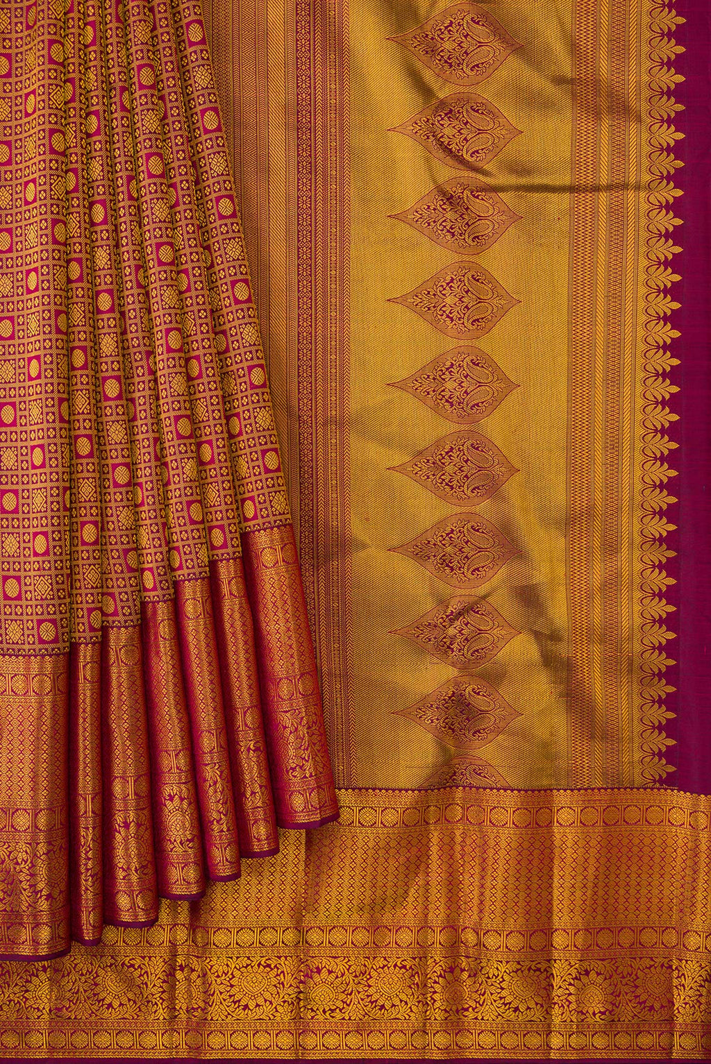 Pleats and pallu of Magenta Kanjivaram Silk Saree with Zari Brocade on the body and Fancy Border. 