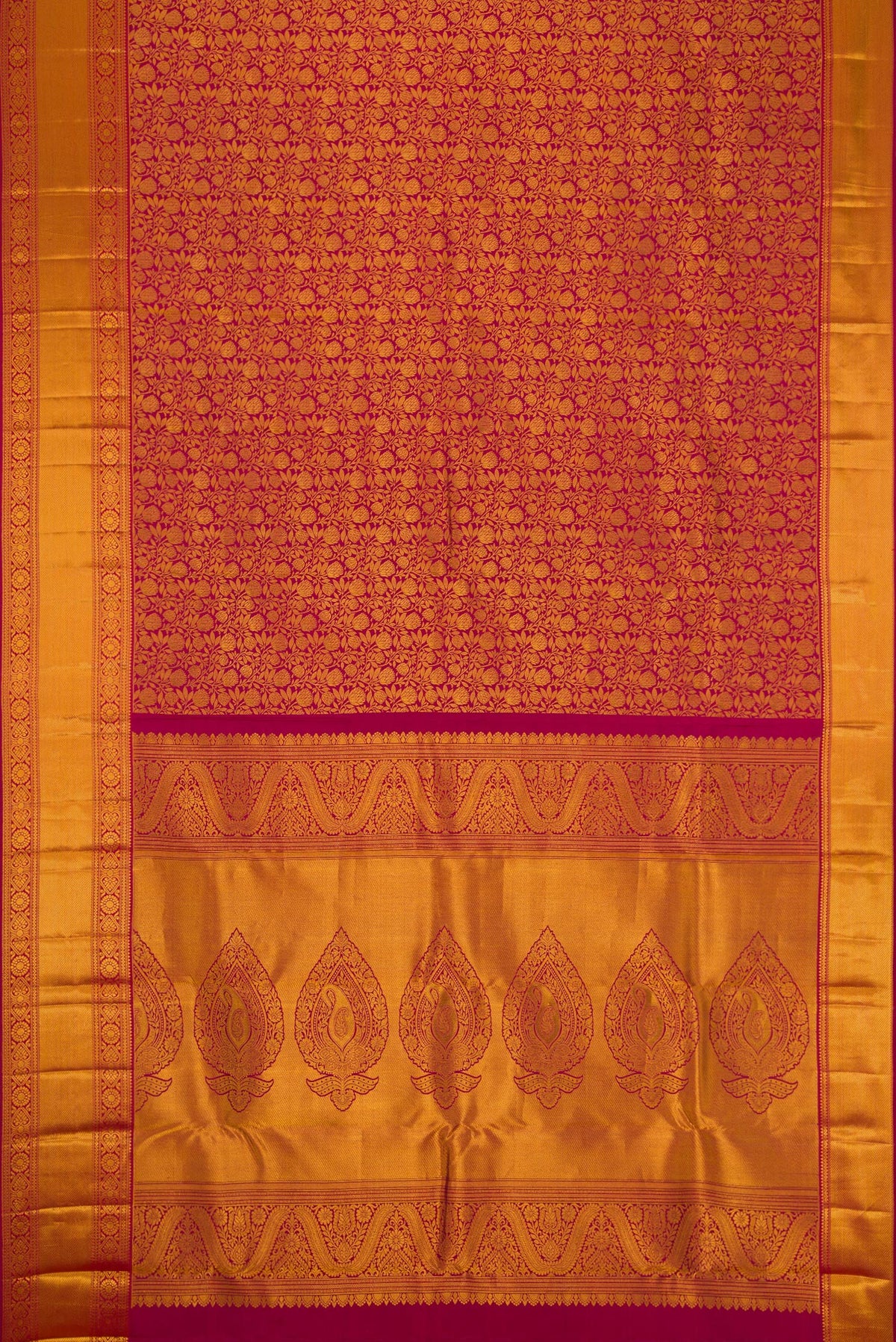 Flat view of Maroon Kanjivaram Silk Saree with Zari Brocade on the body and Zari Border. 