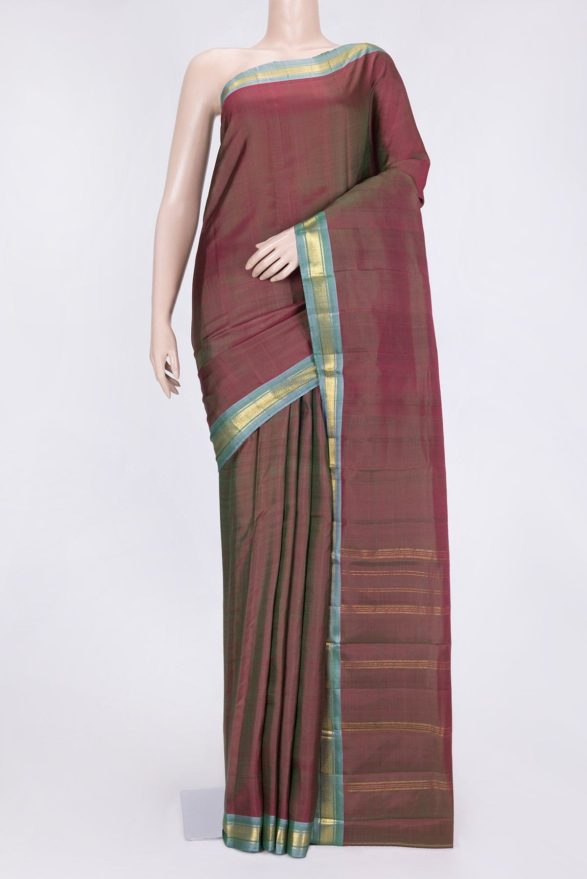 Mehandi Green Dual Tone Kanchipuram Saree with Plain Body and Zari Border.  displayed on a mannequin