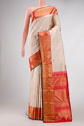 Pure Silk Pure Zari Rose Gold Dual Tone Kanchipuram Saree with Stripes on the body and Zari Border displayed on a mannequin