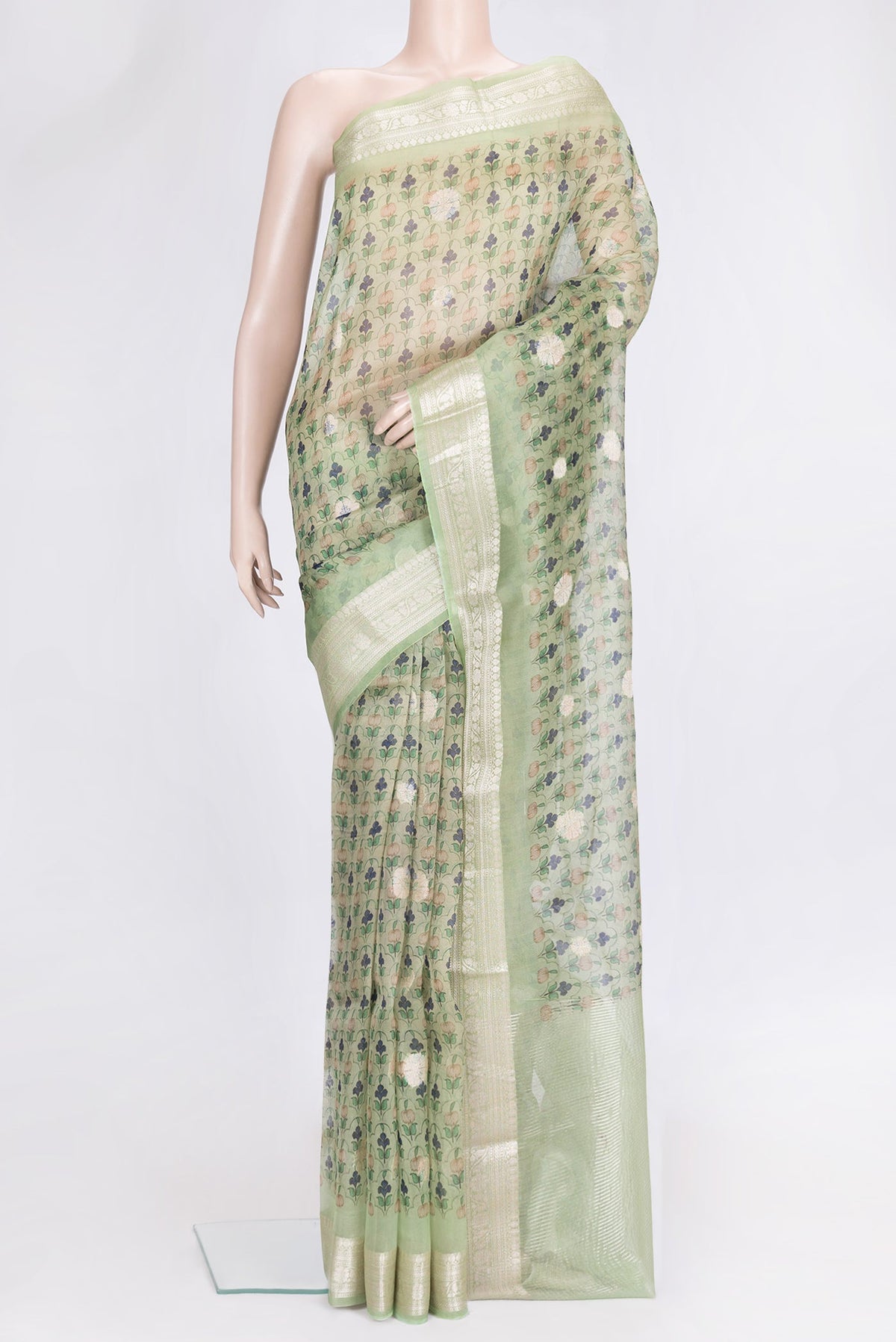 Pista Green Dual Tone Organza Silk Saree with Printed design on the body and Zari Border.  displayed on a mannequin
