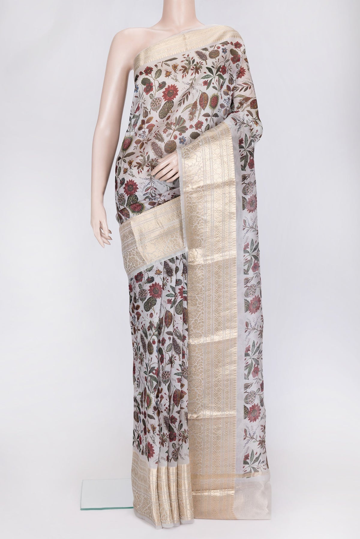 Grey Dual Tone Organza Silk Saree with Printed design on the body and Zari Border.  displayed on a mannequin
