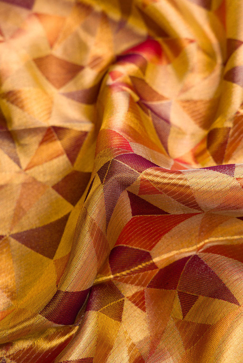 Close up of Gold Dual Tone Kanjivaram Tissue Silk Saree with Zari Brocade on the body and Zari Border.  displaying folds