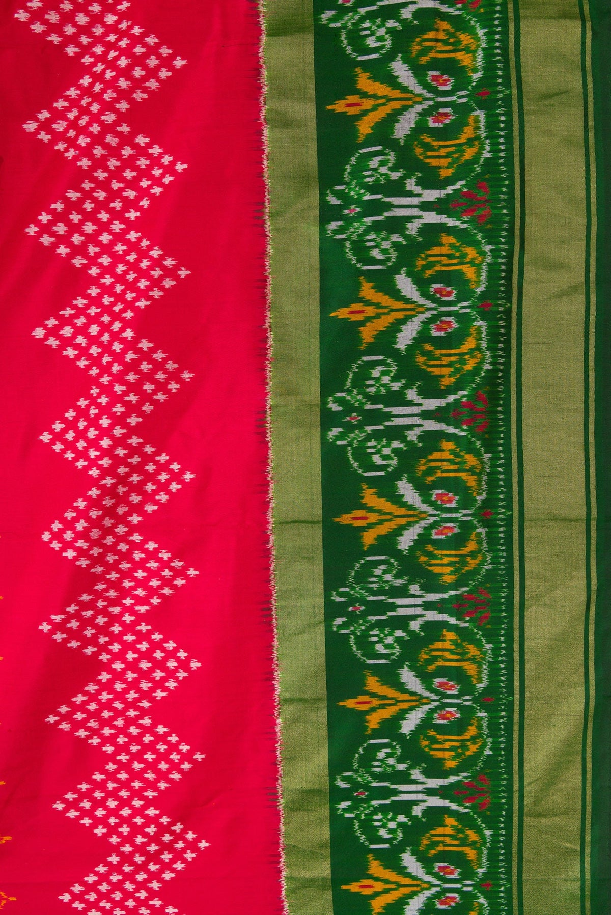 Border image of Red Dual Tone Double Ikat Saree with Ikat Print on the body and Ikat Border. 