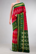Red Dual Tone Double Ikat Saree with Ikat Print on the body and Ikat Border.  displayed on a mannequin