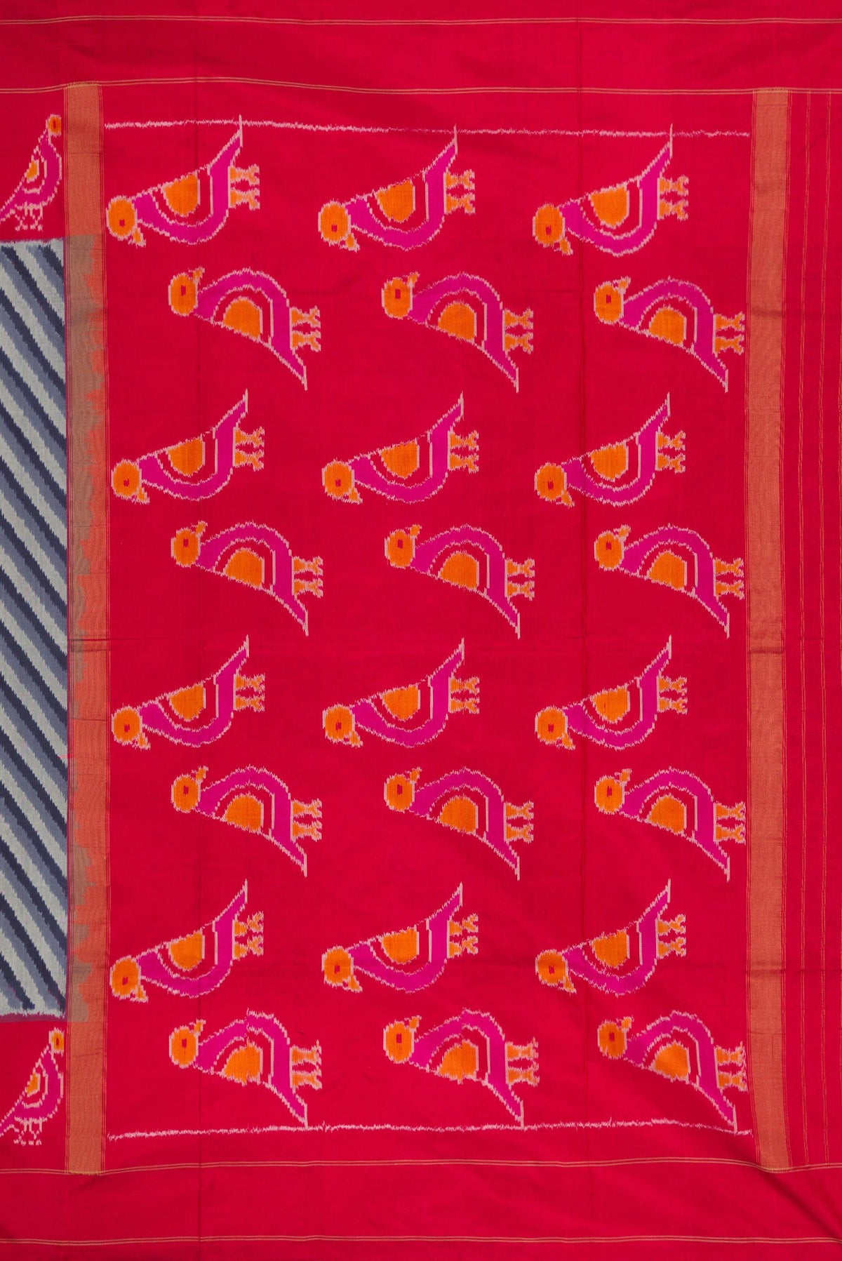 Close up image of the pallu of Grey Dual Tone Double Ikat Saree with Ikat Print on the body and Ikat Border. 