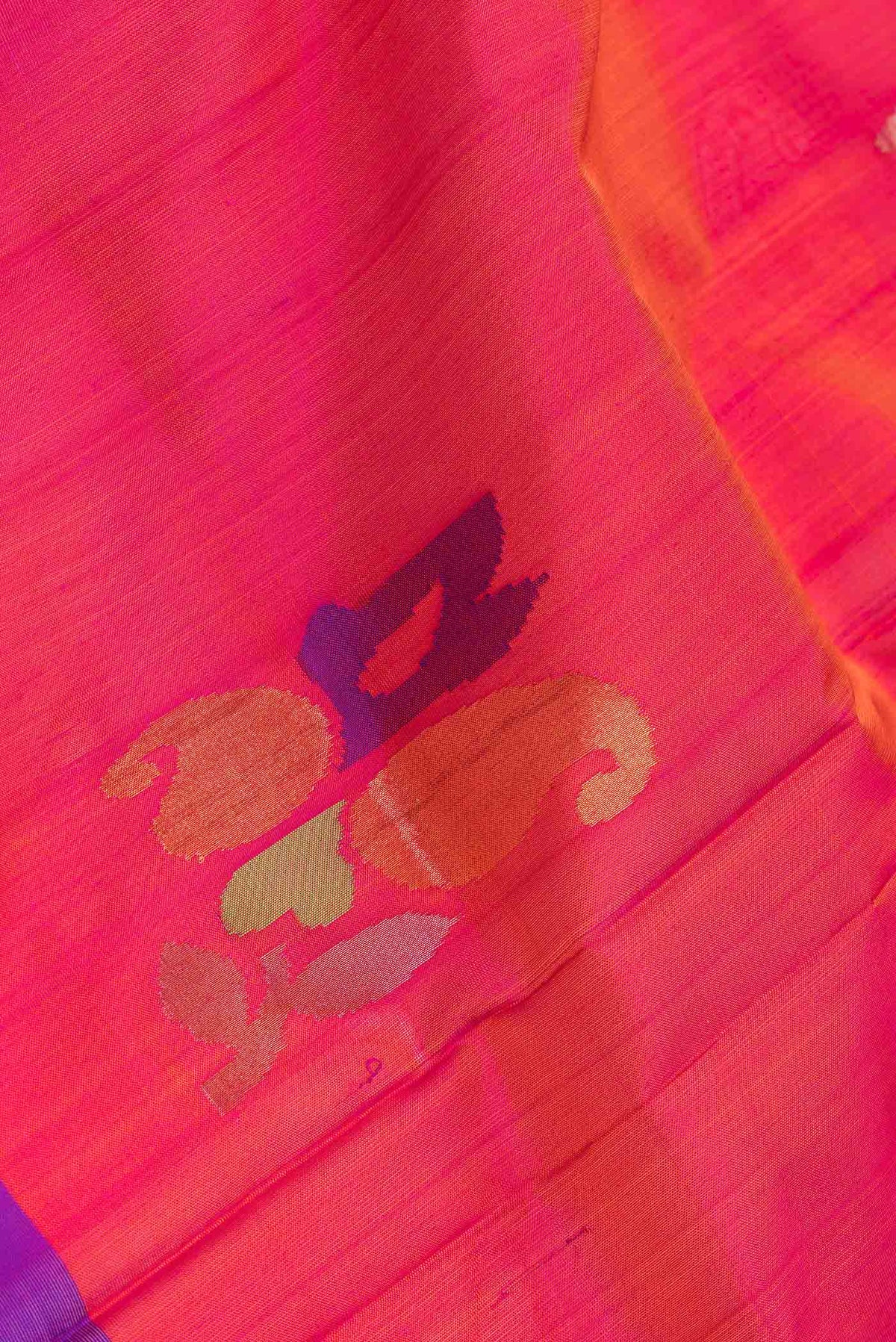 Close up of Pink Dual Tone Uppada Silk Saree with Zari And Thread Butta on the body and Fancy Border.  displaying folds