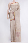Beige Dual Tone Uppada Silk Saree with Zari And Thread Butta on the body and Zari Border.  displayed on a mannequin
