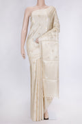 Beige Dual Tone Tussar Silk Saree with Zari Butta on the body and Without Border.  displayed on a mannequin