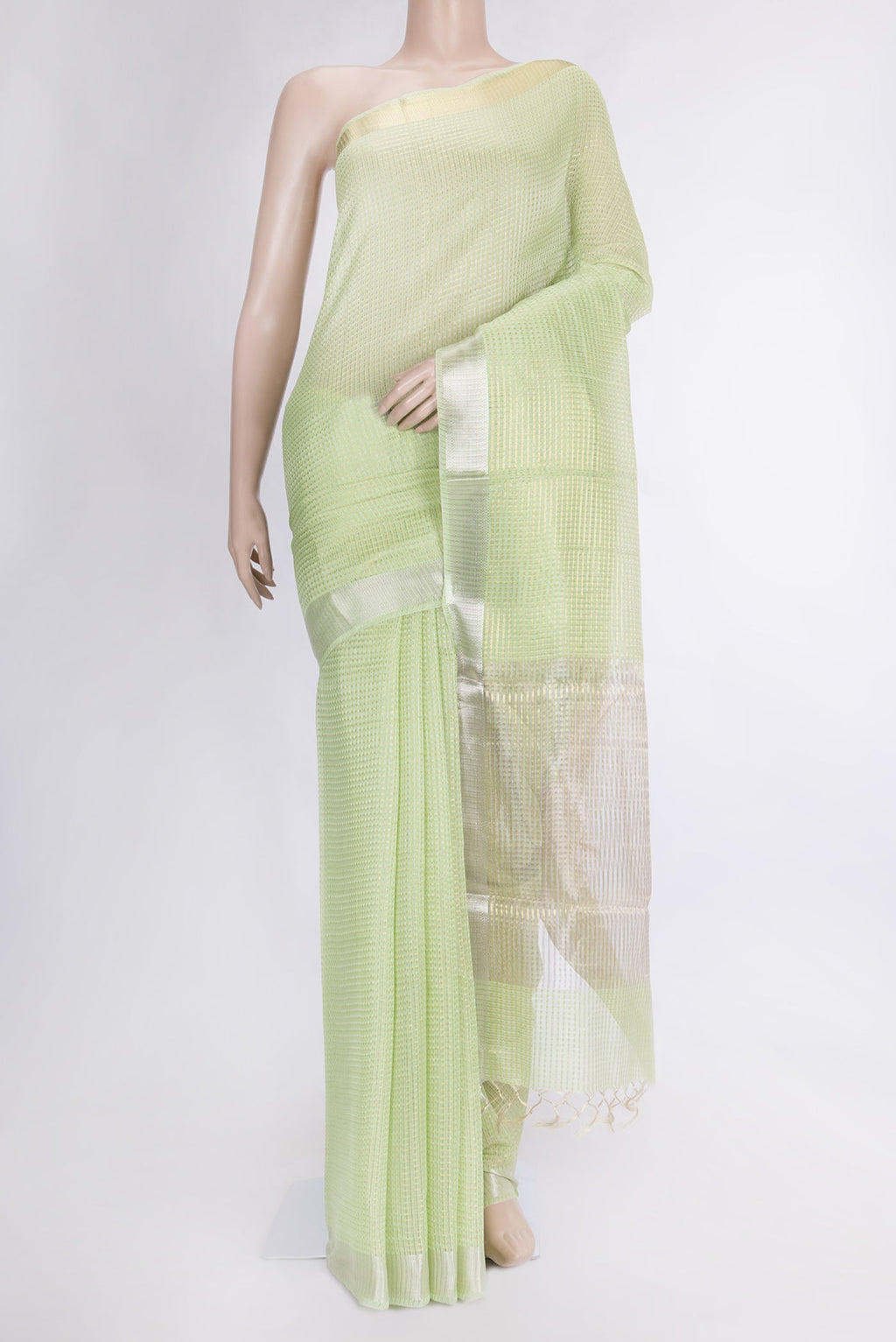 Pista Green Dual Tone Tussar Silk Saree with Checked design on the body and Zari Border.  displayed on a mannequin