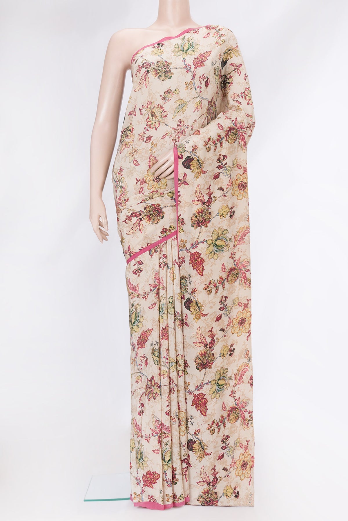 Beige Mysore Crepe Saree with Printed design on the body and Plain Border.  displayed on a mannequin