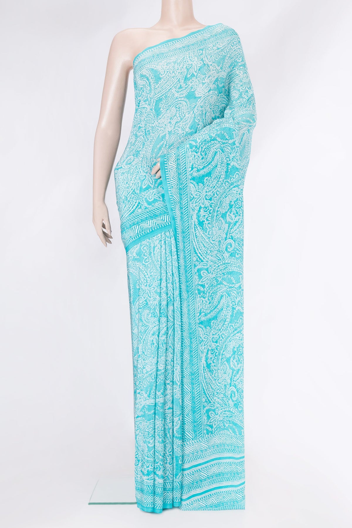 Sky Blue Dual Tone Mysore Crepe Saree with Printed design on the body and Plain Border.  displayed on a mannequin