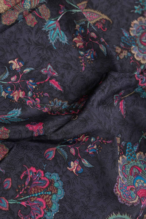 Close up of Grey Dual Tone Mysore Crepe Saree with Printed design on the body and Printed Border.  displaying folds