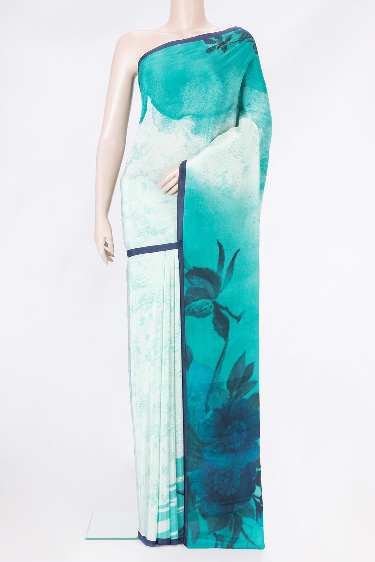 Pista Green Dual Tone Crepe Saree with Printed design on the body and Plain Border.  displayed on a mannequin