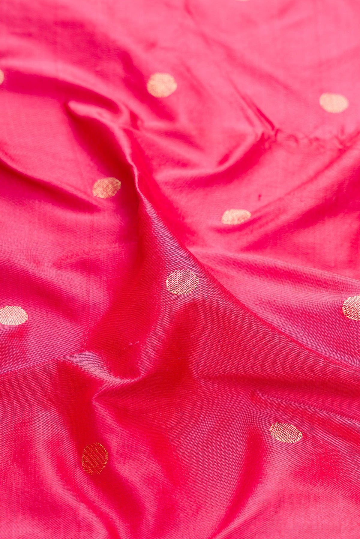 Close up of Pink Dual Tone Paithani Silk Saree with Zari Butta on the body and Paithani Border.  displaying folds