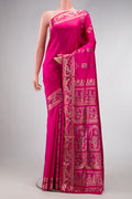 Pink Baluchari Silk Saree with Zari And Thread Butta on the body and Zari Border.  displayed on a mannequin