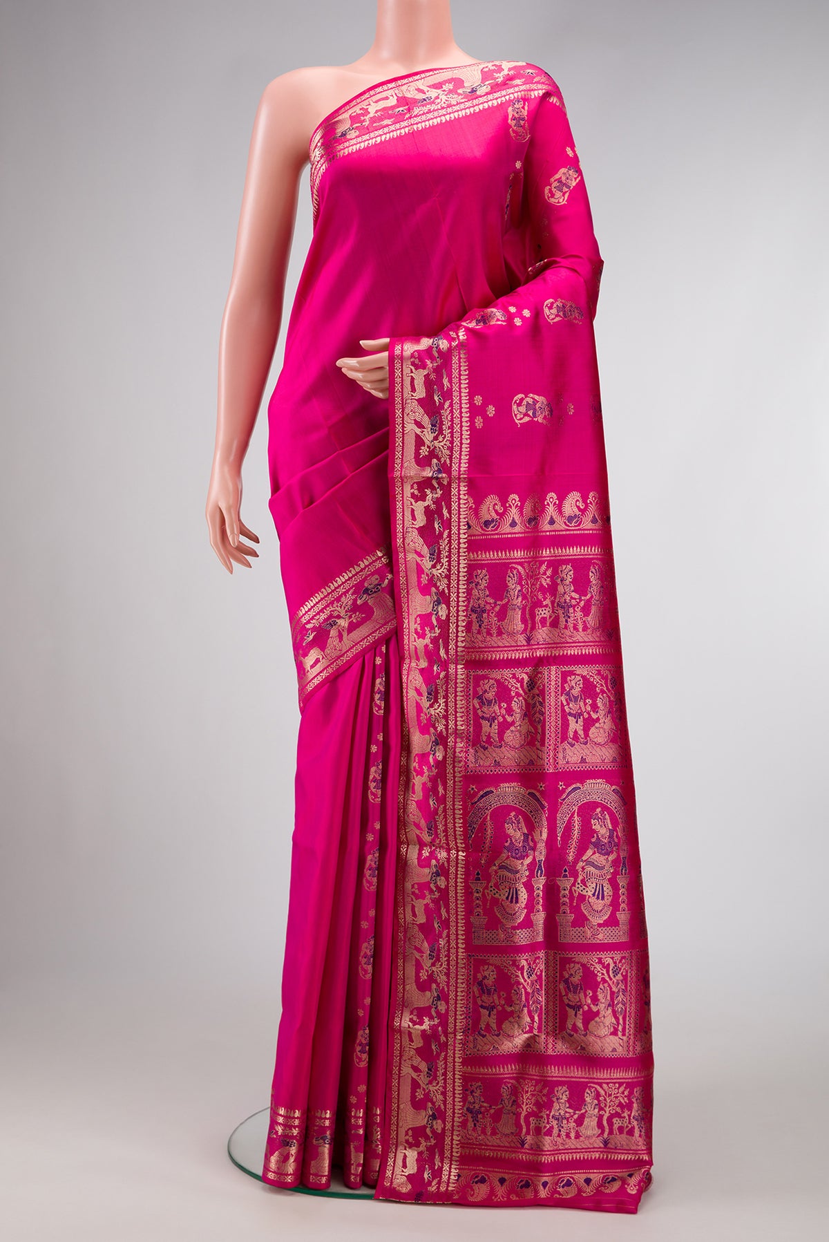 Pink Baluchari Silk Saree with Zari And Thread Butta on the body and Zari Border.  displayed on a mannequin
