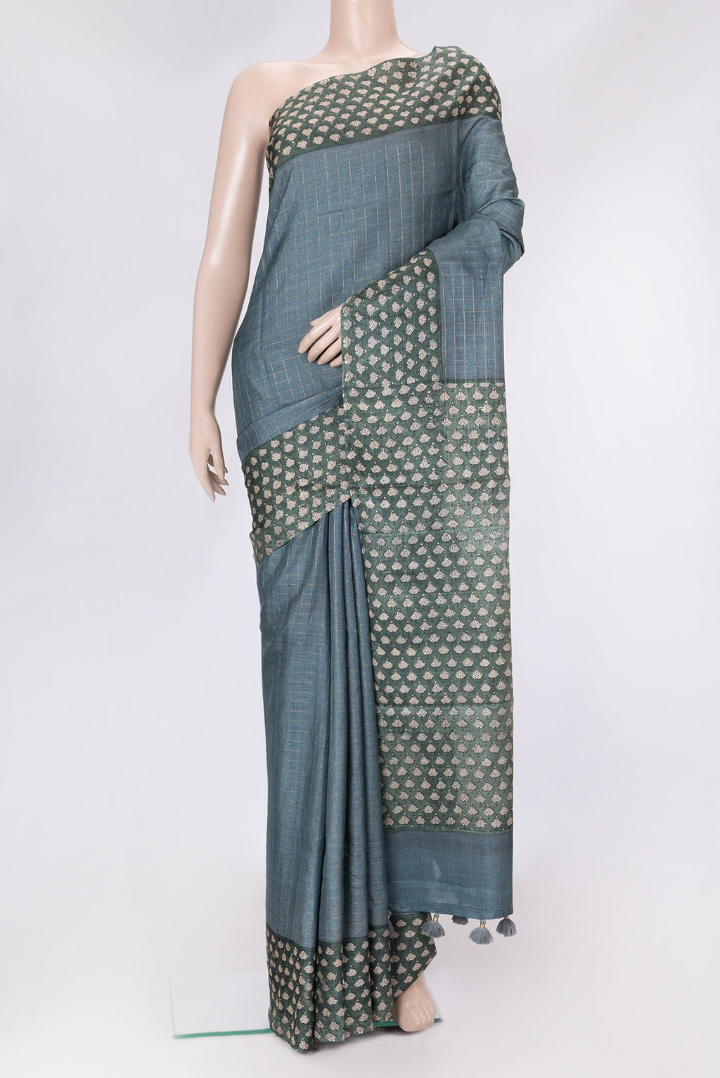 Grey Dual Tone Tussar Silk Saree with Checked design on the body and Printed Border.  displayed on a mannequin