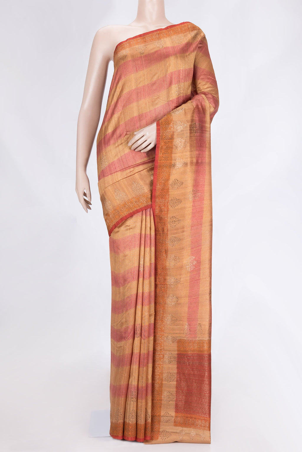 Beige Dual Tone Tussar Saree with Zari Butta on the body and Zari Border.  displayed on a mannequin