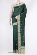 Bottle Green Dual Tone Banarasi Silk Saree with Thread Butta on the body and Thread Border.  displayed on a mannequin