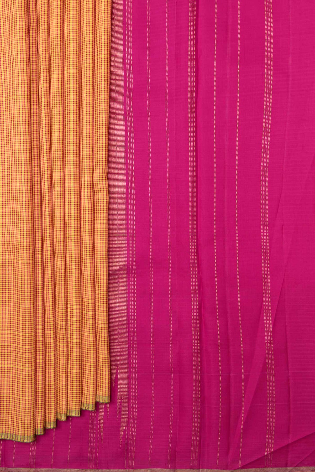 Pleats and pallu of Mustard Dual Tone Kanchipuram Saree with Checked design on the body and Zari Border. 