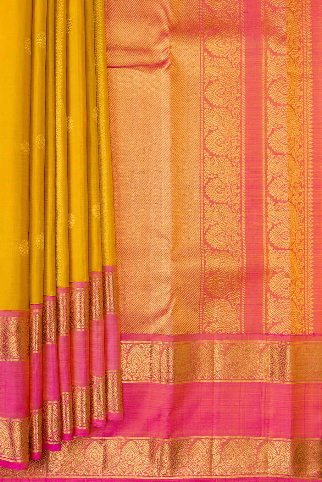 Pleats and pallu of Mustard Dual Tone Kanchipuram Silk Saree with Stripes on the body and Zari Border. 