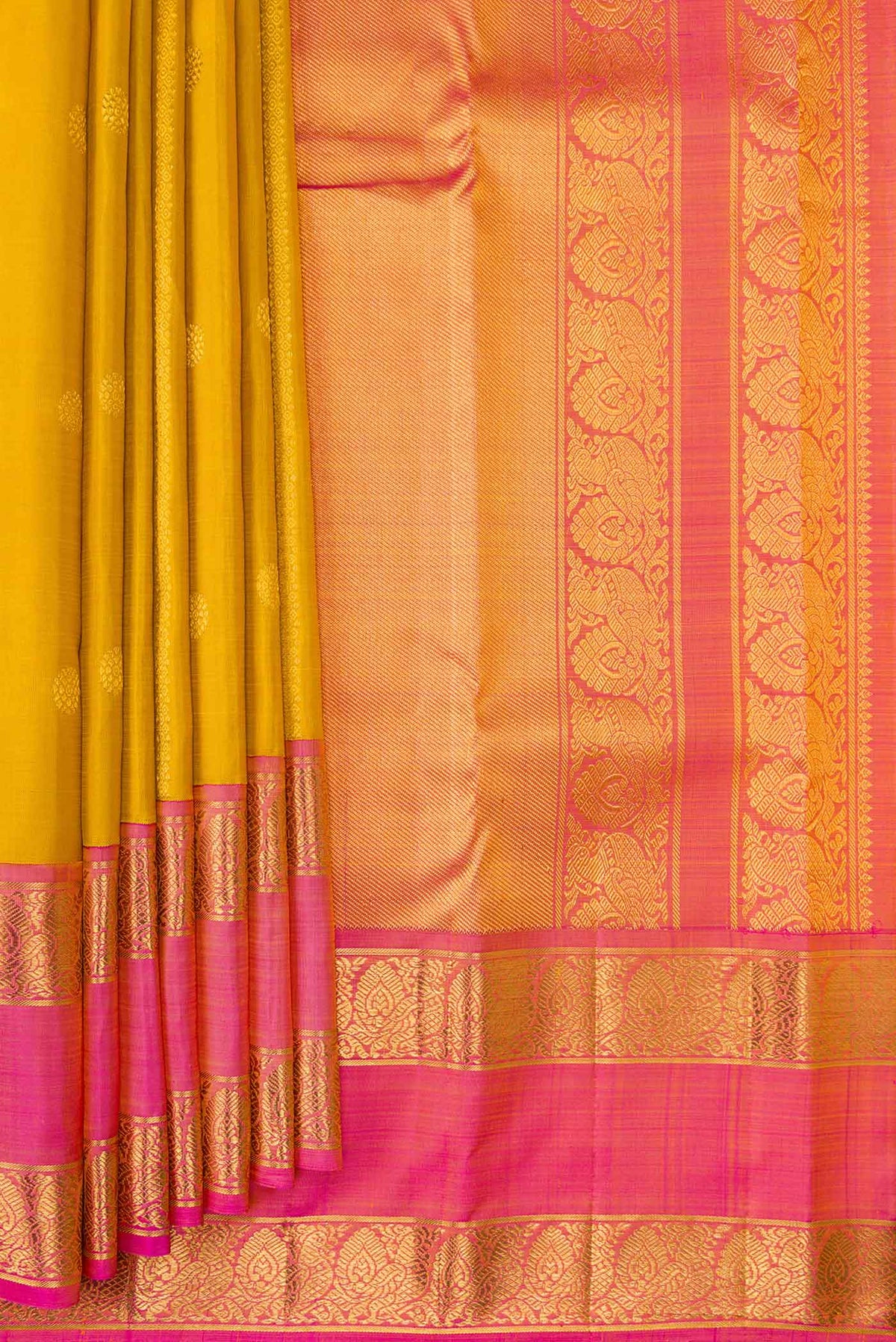 Pleats and pallu of Mustard Dual Tone Kanchipuram Silk Saree with Stripes on the body and Zari Border. 