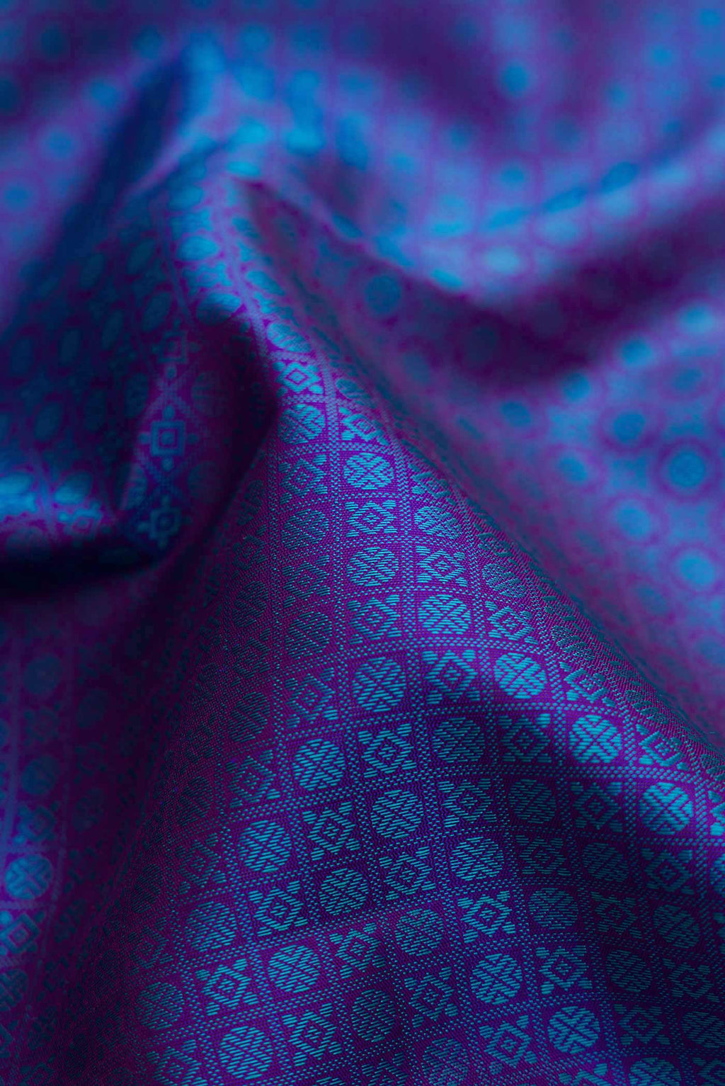 Close up of Pure Silk Pure Zari Royal Blue Dual Tone Kanjivaram Saree with Jacquard With Zari Butta on the body and Zari Border.  displaying folds