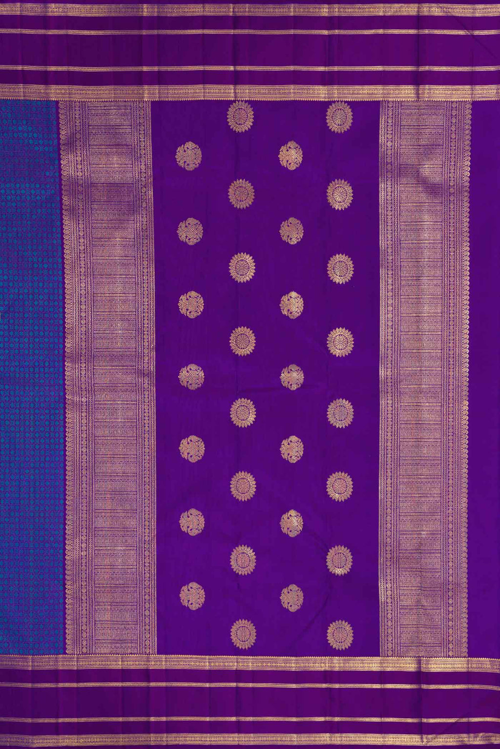 Close up image of the pallu of Pure Silk Pure Zari Royal Blue Dual Tone Kanjivaram Saree with Jacquard With Zari Butta on the body and Zari Border. 