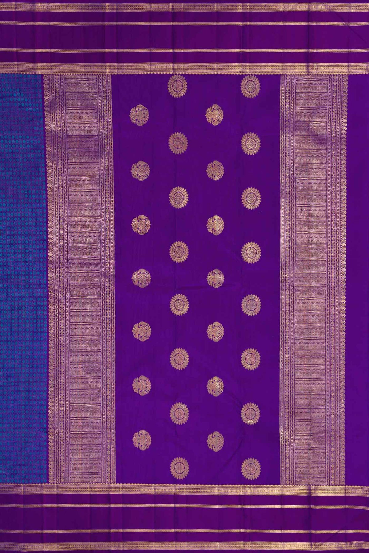 Close up image of the pallu of Pure Silk Pure Zari Royal Blue Dual Tone Kanjivaram Saree with Jacquard With Zari Butta on the body and Zari Border. 